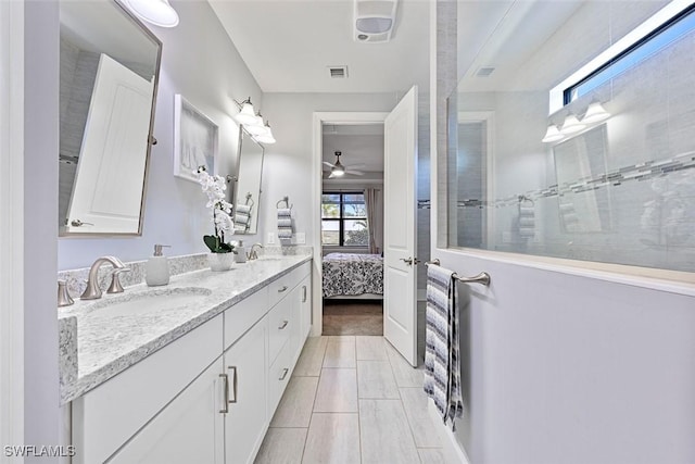 bathroom with vanity, a shower, and ceiling fan