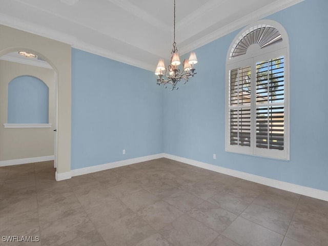 empty room with ornamental molding and a chandelier