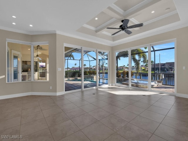 unfurnished room featuring coffered ceiling, light tile patterned floors, ceiling fan, crown molding, and a water view