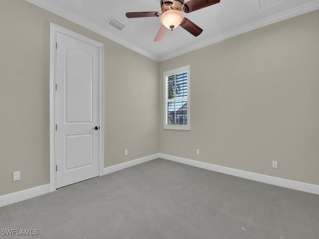 carpeted empty room with ornamental molding and ceiling fan