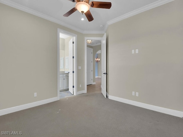 empty room with ornamental molding, ceiling fan with notable chandelier, and light colored carpet