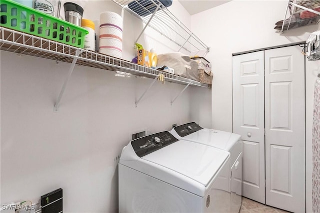 washroom featuring washer and dryer