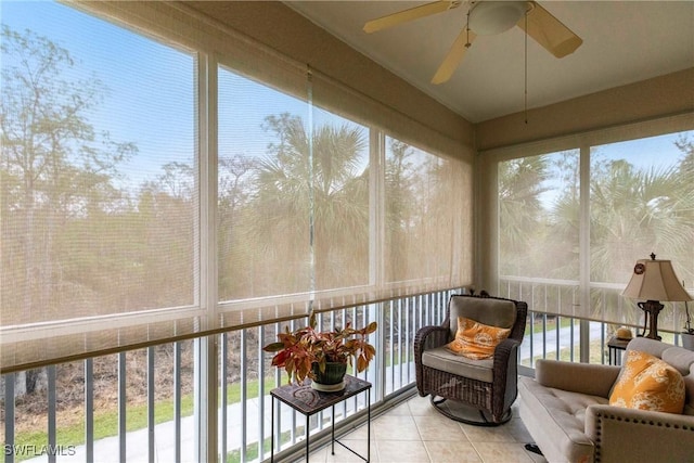 sunroom featuring ceiling fan