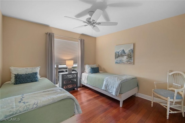 bedroom featuring ceiling fan and dark hardwood / wood-style floors