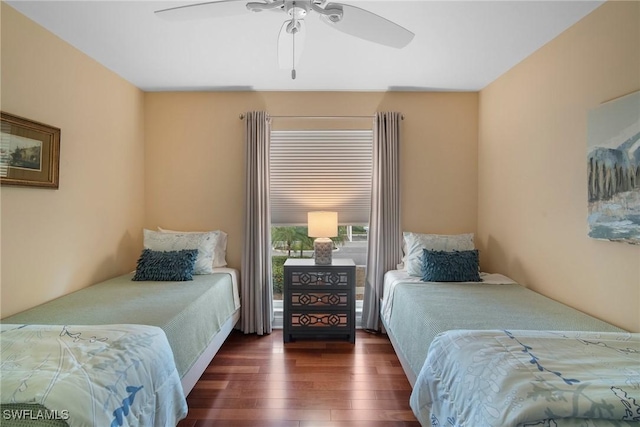 bedroom featuring dark wood-type flooring and ceiling fan