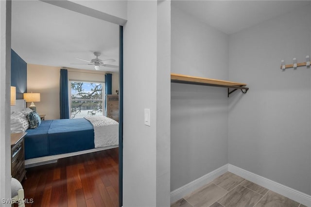 bedroom with hardwood / wood-style floors and ceiling fan