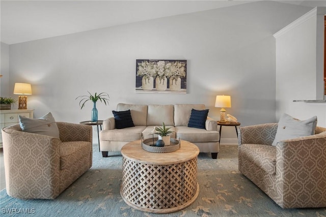 living room featuring lofted ceiling