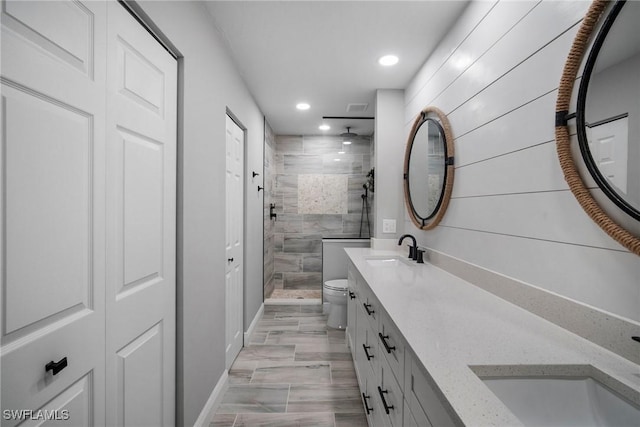 845 Gulf Pavilion Dr Unit 204, Naples, FL 34108 - full bathroom with a shower stall, double vanity, recessed lighting, and toilet