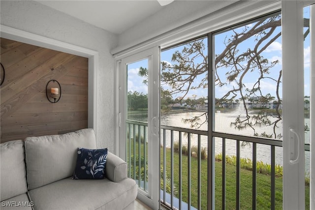 unfurnished sunroom with a water view