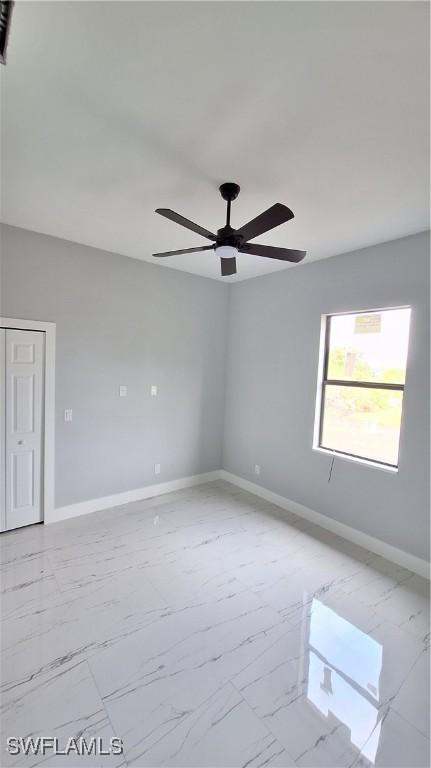 spare room featuring ceiling fan