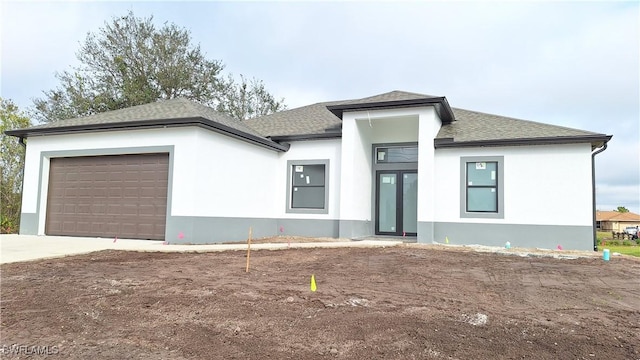 prairie-style house featuring a garage