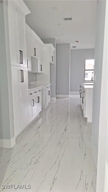 kitchen featuring white cabinetry