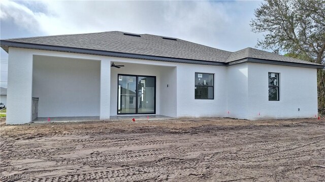 rear view of house with ceiling fan