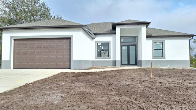 prairie-style home with a garage