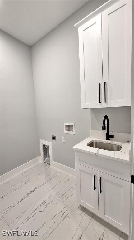 clothes washing area with cabinet space, a sink, marble finish floor, washer hookup, and electric dryer hookup