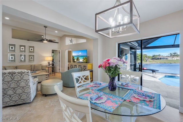 dining room featuring ceiling fan with notable chandelier