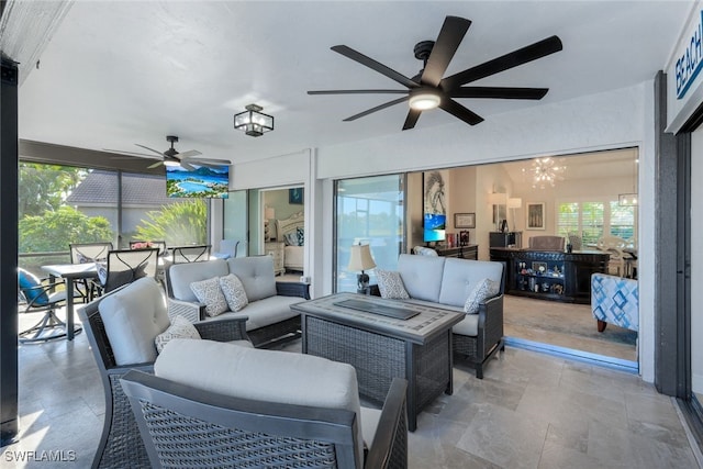 interior space with ceiling fan and an outdoor living space