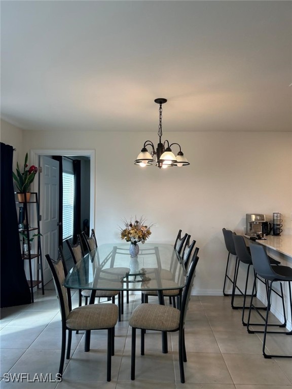 dining space featuring a notable chandelier