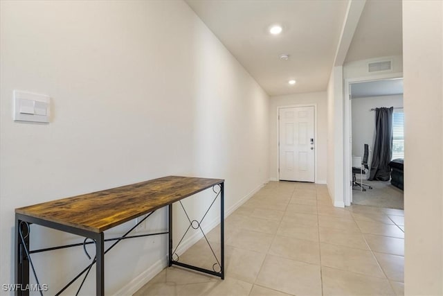 hallway featuring light tile patterned floors