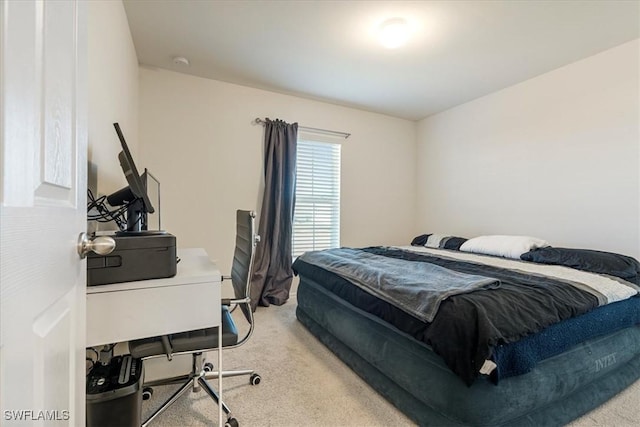 bedroom with light colored carpet