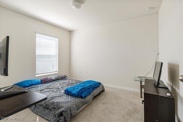 bedroom with light colored carpet