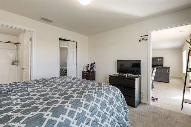 carpeted bedroom with a closet