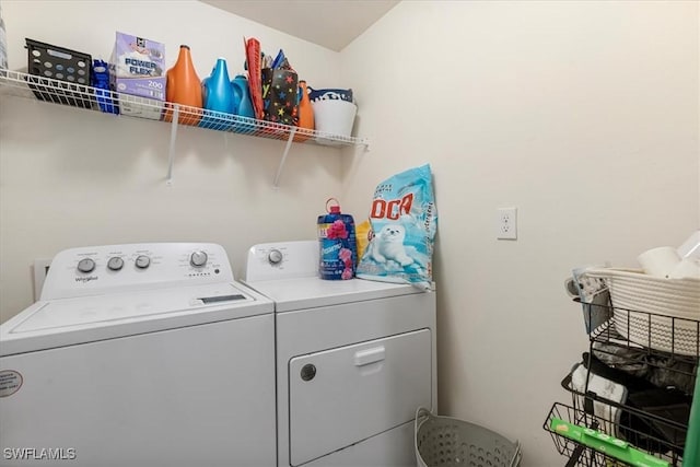 clothes washing area with washer and dryer