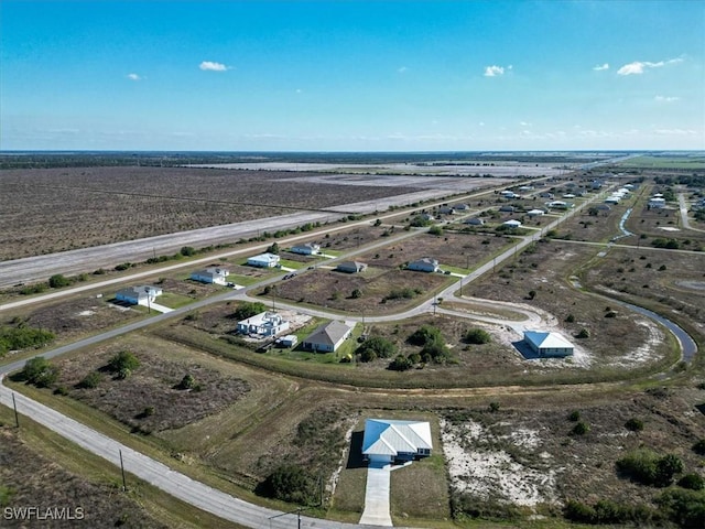 birds eye view of property featuring a rural view