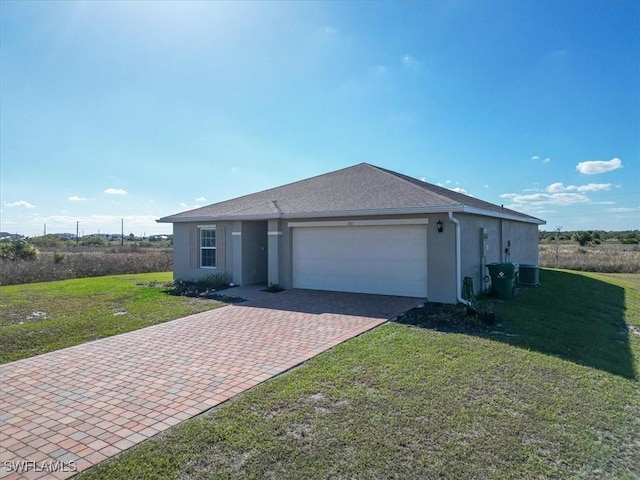 ranch-style home with a garage and a front yard