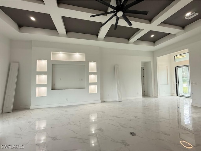 empty room featuring ceiling fan, a high ceiling, beamed ceiling, and coffered ceiling