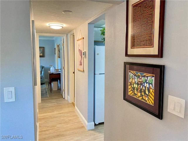 hall with light wood-type flooring