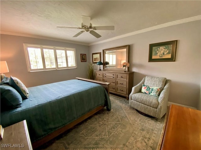 bedroom featuring hardwood / wood-style floors, ornamental molding, and ceiling fan