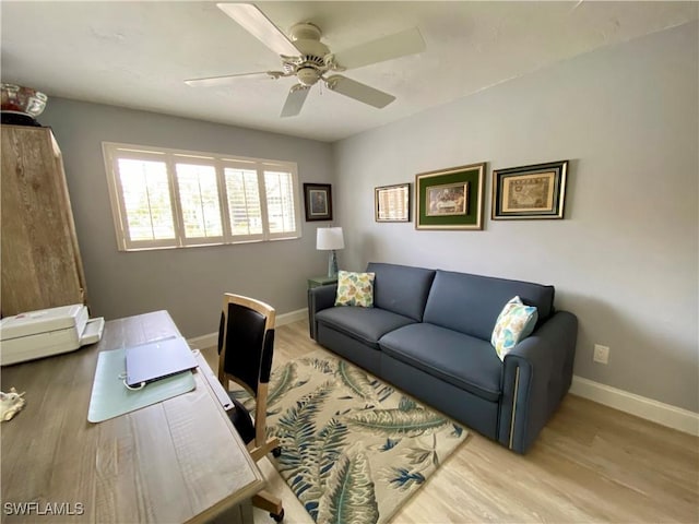 office space with ceiling fan and light hardwood / wood-style floors