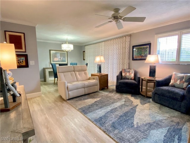 living room with ceiling fan, ornamental molding, and light hardwood / wood-style flooring