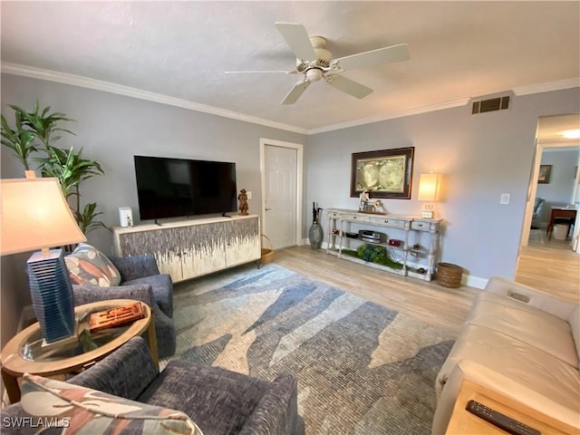 living room with crown molding, ceiling fan, and hardwood / wood-style floors