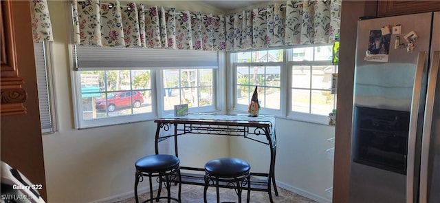 dining area featuring baseboards