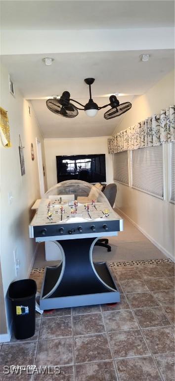 interior space with baseboards and visible vents