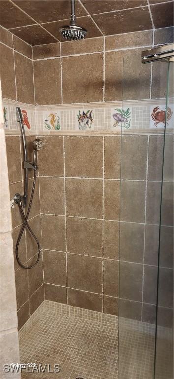 bathroom with tiled shower