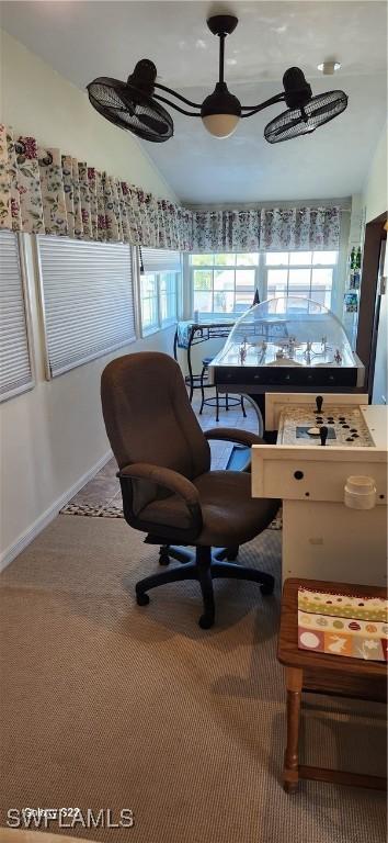 home office featuring baseboards, carpet, and vaulted ceiling