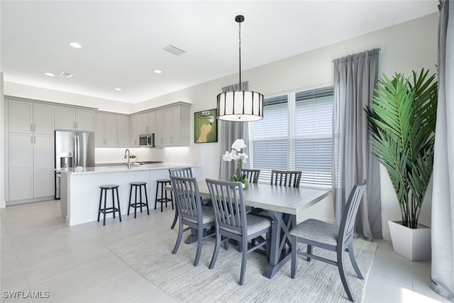 tiled dining space with sink