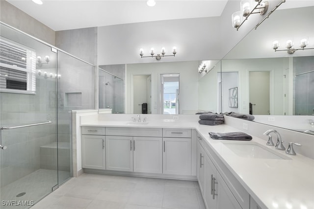 bathroom with plenty of natural light, walk in shower, and vanity