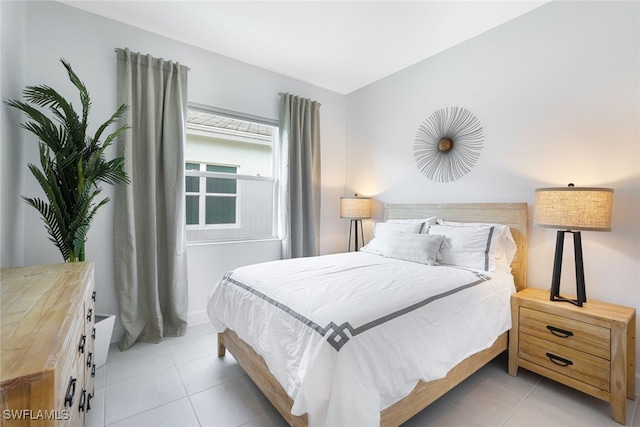 bedroom featuring light tile patterned floors