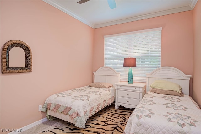 bedroom with ceiling fan, carpet, and crown molding