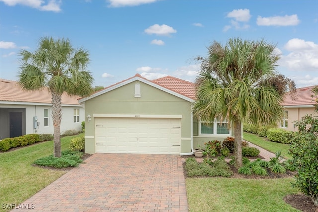 view of front facade with a garage and a front lawn