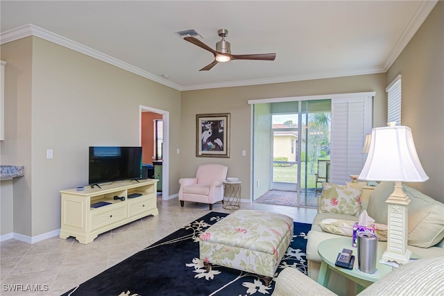 tiled living room with ceiling fan and crown molding