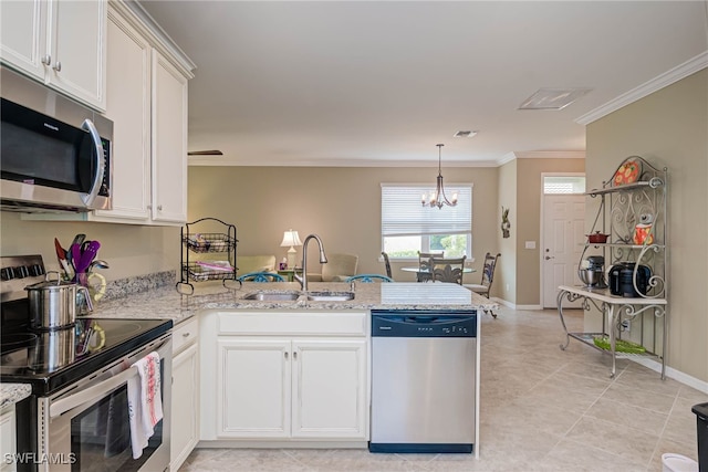 kitchen featuring stainless steel appliances, kitchen peninsula, and light stone counters