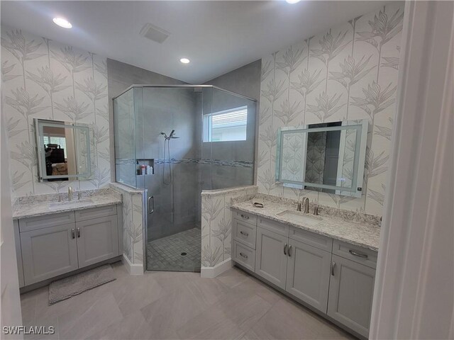 bathroom with vanity and an enclosed shower