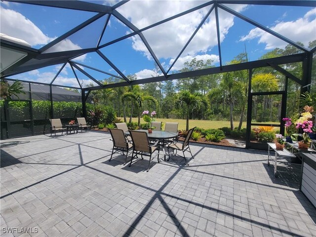 view of patio / terrace with glass enclosure