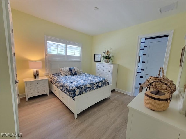 bedroom with light hardwood / wood-style flooring