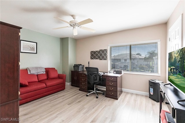 office area featuring light wood-style flooring, baseboards, and ceiling fan